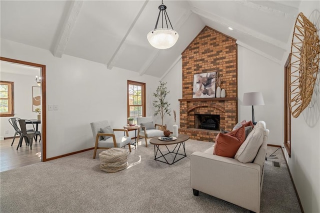 3438 N 123rd St, Kansas City, KS 66109 - carpeted living room with lofted ceiling with beams, a wealth of natural light, a fireplace, and baseboards