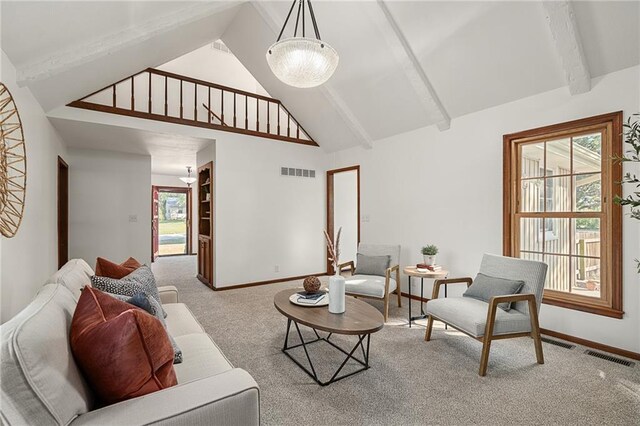 3438 N 123rd St, Kansas City, KS 66109 - living room featuring beamed ceiling, baseboards, carpet, and visible vents