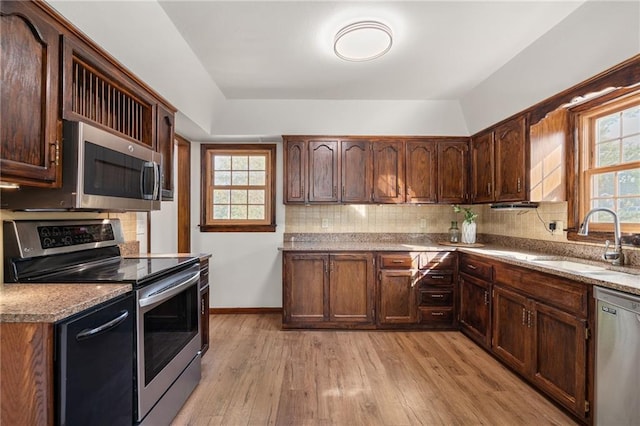 3438 N 123rd St, Kansas City, KS 66109 - kitchen with backsplash, light wood finished floors, appliances with stainless steel finishes, and a sink