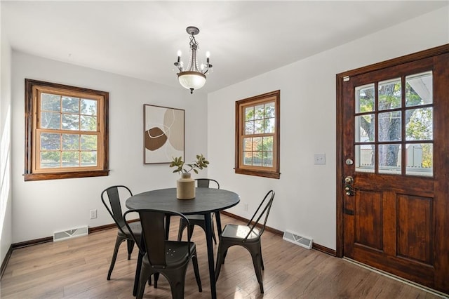 3438 N 123rd St, Kansas City, KS 66109 - dining area featuring light wood-style flooring, baseboards, and visible vents