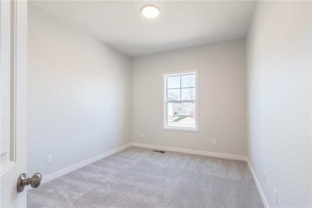 spare room with light carpet