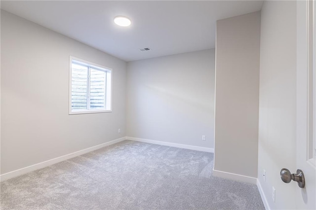 empty room featuring light colored carpet