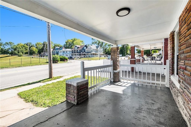 view of patio with a residential view and covered porch