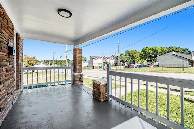 balcony featuring a residential view and a porch