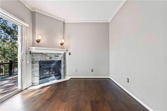 unfurnished living room featuring wood-type flooring, a stone fireplace, and ornamental molding