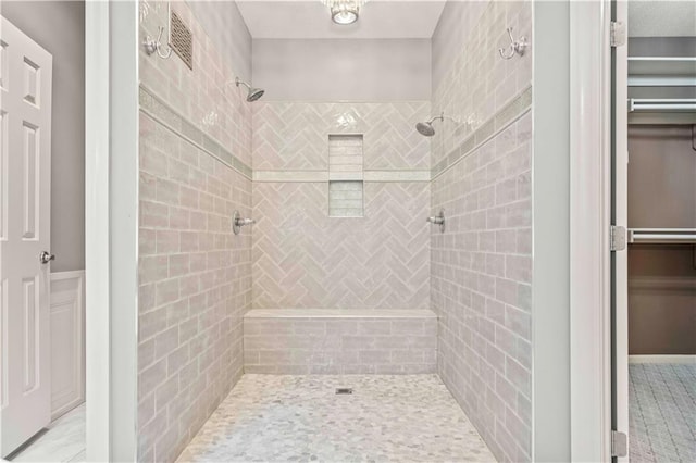 bathroom with a tile shower