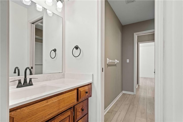 bathroom with wood-type flooring and vanity