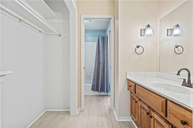 bathroom with vanity, shower / tub combo, and hardwood / wood-style flooring