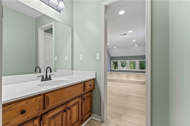 bathroom featuring wood-type flooring and vanity