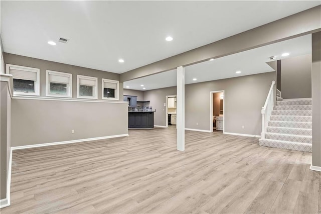 unfurnished living room with light wood-type flooring