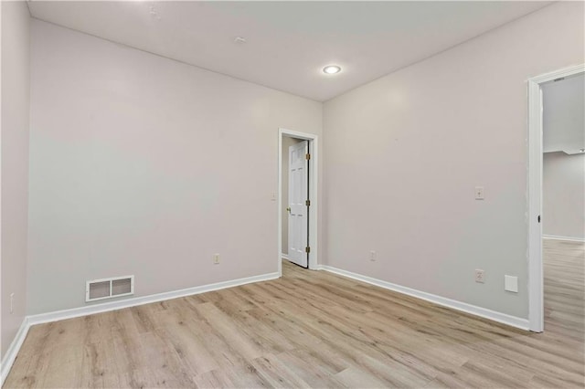 empty room with light hardwood / wood-style floors