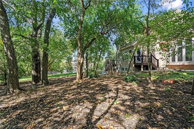 view of yard with a wooden deck