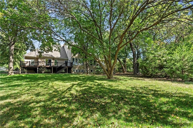 view of yard featuring a wooden deck