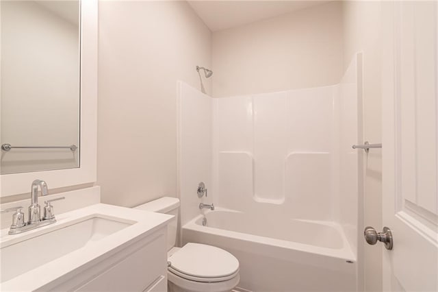 full bathroom featuring tub / shower combination, vanity, and toilet