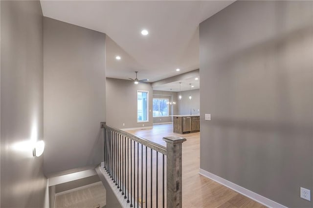 interior space with hardwood / wood-style floors, sink, and ceiling fan