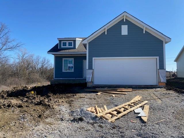 view of front of home featuring driveway and a garage