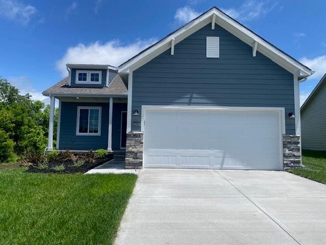 20870 W 190th Ter, Spring Hill, KS 66083 - craftsman inspired home with stone siding, concrete driveway, a front yard, and a garage