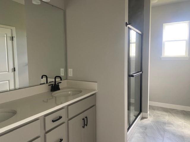20870 W 190th Ter, Spring Hill, KS 66083 - bathroom featuring double vanity, marble look tile flooring, and a stall shower