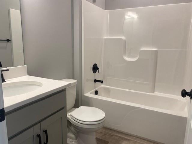 20870 W 190th Ter, Spring Hill, KS 66083 - bathroom featuring wood finished floors, vanity, and shower / bath combination