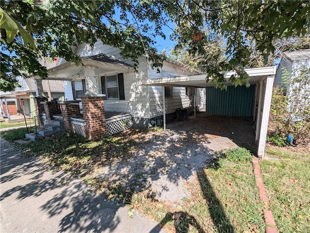 view of front of home featuring a carport