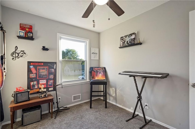 misc room featuring carpet and ceiling fan