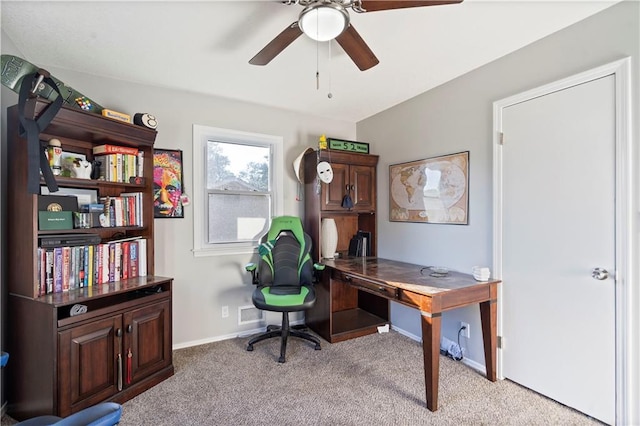 carpeted home office with vaulted ceiling and ceiling fan