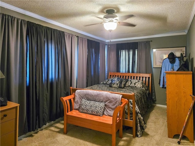 carpeted bedroom featuring ceiling fan, crown molding, and a textured ceiling