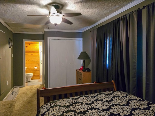 bedroom featuring carpet floors, a closet, a textured ceiling, ceiling fan, and ornamental molding