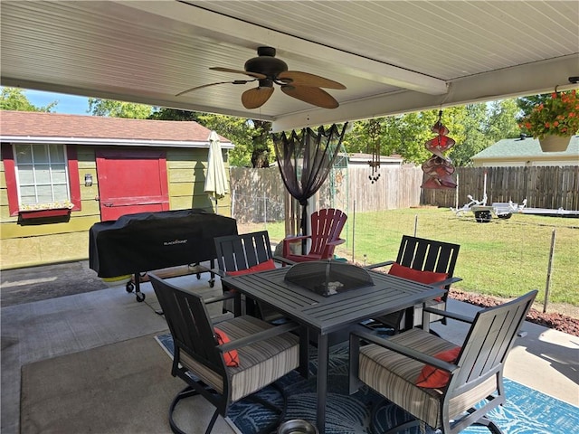 view of patio with ceiling fan and a grill