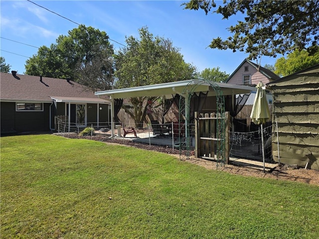 rear view of house with a lawn, a gazebo, and a patio area