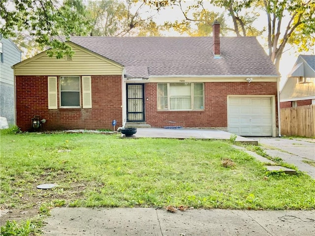 view of front facade with a garage and a front lawn