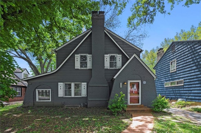 507 E 75th St, Kansas City, MO 64131 - view of front of home with a chimney and brick siding