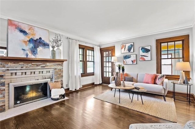 507 E 75th St, Kansas City, MO 64131 - living room featuring ornamental molding, baseboards, wood finished floors, and a healthy amount of sunlight