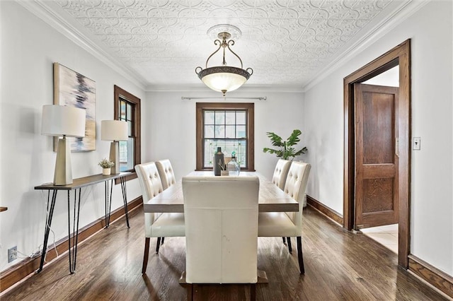 507 E 75th St, Kansas City, MO 64131 - dining space featuring dark wood-type flooring, an ornate ceiling, crown molding, and baseboards