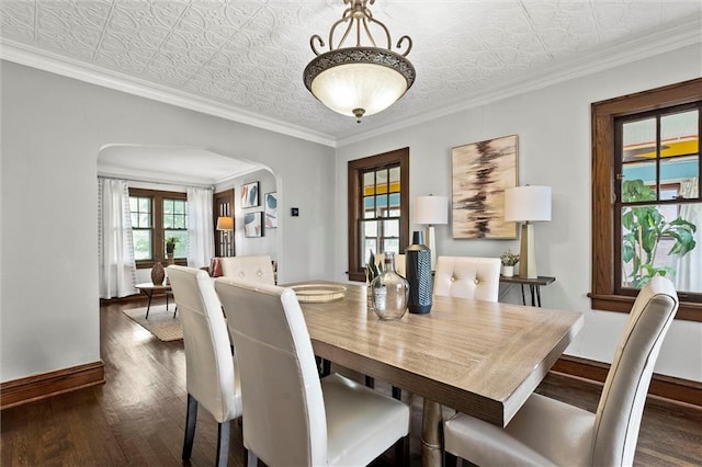 507 E 75th St, Kansas City, MO 64131 - dining space featuring an ornate ceiling, baseboards, dark wood finished floors, and arched walkways