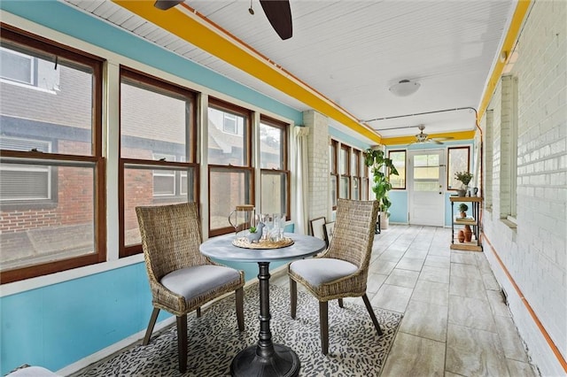 507 E 75th St, Kansas City, MO 64131 - sunroom with ceiling fan and brick wall