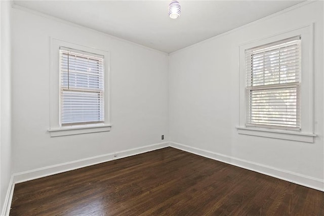 507 E 75th St, Kansas City, MO 64131 - unfurnished room with dark wood-type flooring, crown molding, and baseboards