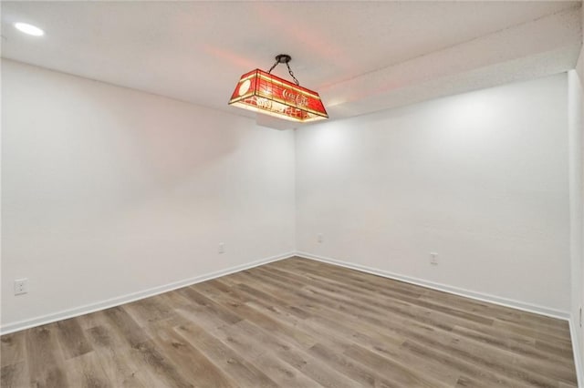 unfurnished room featuring hardwood / wood-style floors