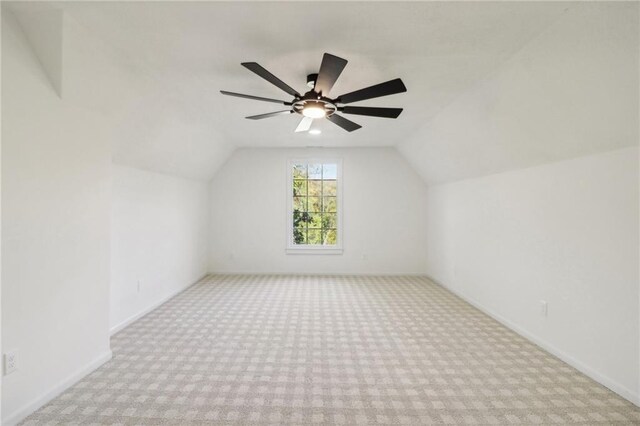 bonus room featuring light carpet, lofted ceiling, and ceiling fan