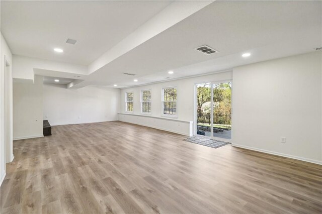 unfurnished living room featuring light hardwood / wood-style flooring