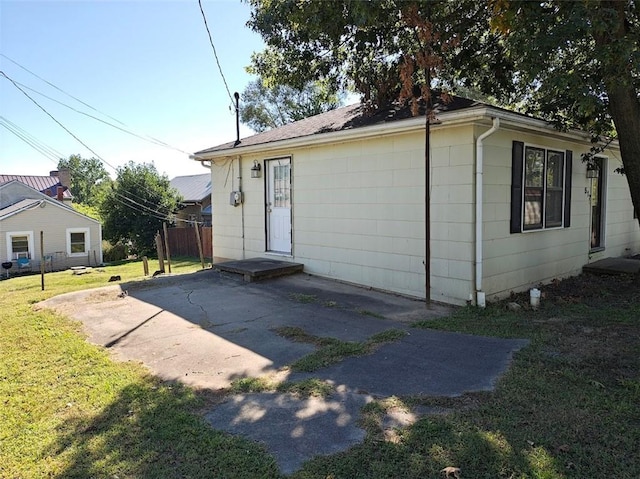 exterior space with a lawn and a patio area