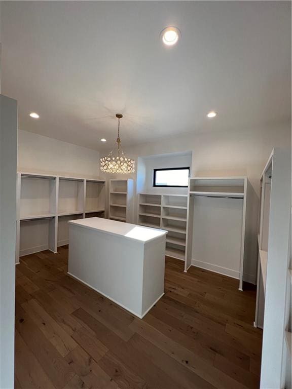 spacious closet with dark hardwood / wood-style floors