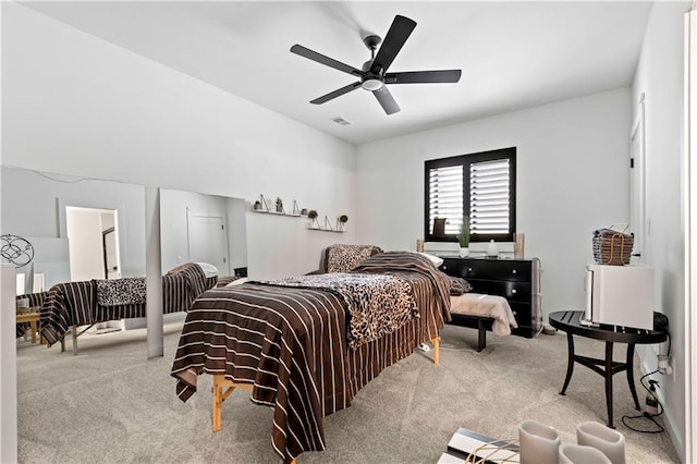 bedroom with ceiling fan and light carpet