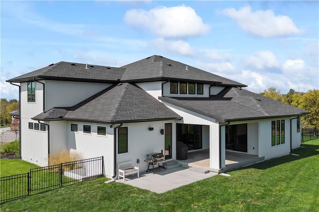 back of property featuring a lawn and a patio area