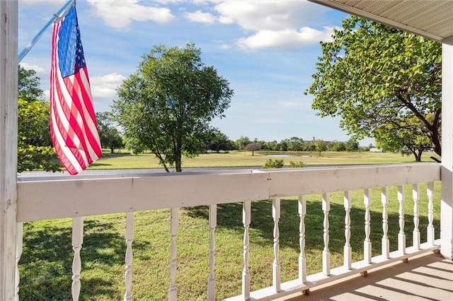 view of yard with a balcony