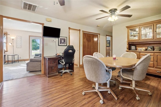 dining room featuring light hardwood / wood-style flooring and ceiling fan