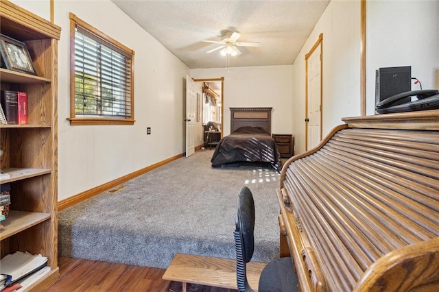 bedroom with ceiling fan and hardwood / wood-style flooring