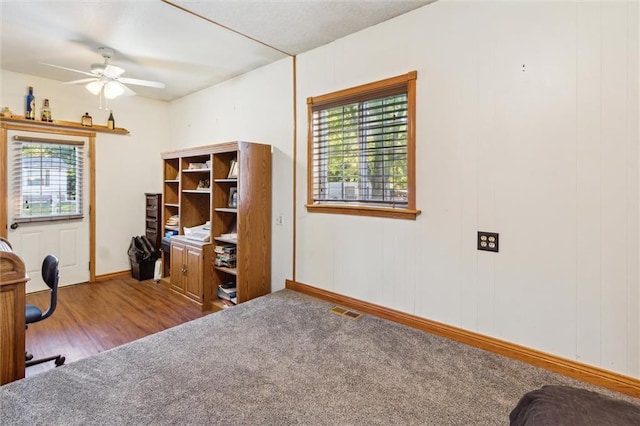 office with wood-type flooring, plenty of natural light, and ceiling fan