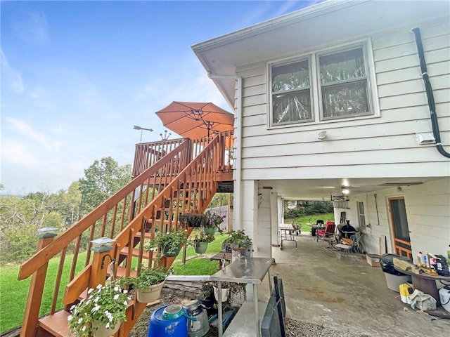 31688 Highline Dr, Warsaw, MO 65355 - view of side of home featuring a deck, a patio area, and stairway