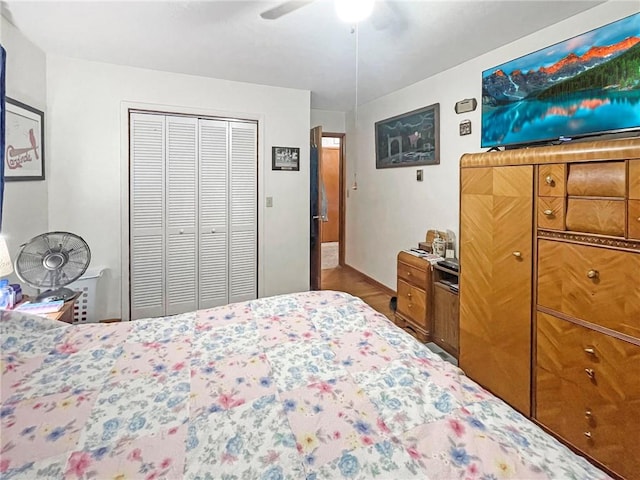 bedroom with ceiling fan and a closet